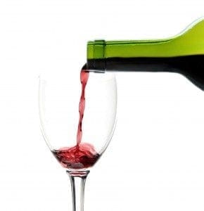 red wine glass and bottle