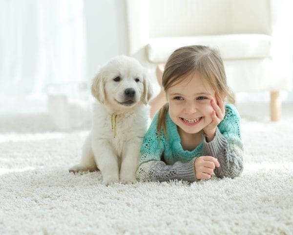 child_puppy_on_carpet