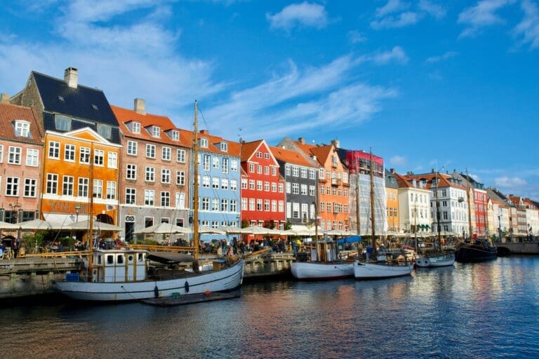 Copenhagen, the vibrant capital of Denmark, is a city that blends historical charm with modern flair. Known for its rich history, stunning architecture, and progressive culture, Copenhagen offers a plethora of attractions that captivate both locals and tourists alike. For anyone planning a 'tur til København' (trip to Copenhagen), here are the top five must-see attractions that should be on your itinerary. Nyhavn: The Iconic Waterfront No visit to Copenhagen is complete without a stroll through Nyhavn. This picturesque canal district is lined with colorful 17th-century townhouses, vibrant bars, and cozy restaurants. Originally a busy commercial port where ships from around the world would dock, today Nyhavn is a hub of relaxation and enjoyment. Take a leisurely walk along the canal, admire the historic wooden ships, or settle down at one of the many cafes for a traditional Danish meal. The atmosphere is especially magical during the evening when the lights reflect off the water, creating a romantic and inviting ambiance. Nyhavn is not just a place to visit but an experience to savor, offering a perfect blend of history and modern-day leisure. Tivoli Gardens: A Whimsical Wonderland Tivoli Gardens is one of the oldest amusement parks in the world, having opened in 1843. Located in the heart of Copenhagen, Tivoli is more than just an amusement park; it is a cultural icon and a beloved destination for both locals and tourists. With its beautiful gardens, thrilling rides, and vibrant entertainment, Tivoli offers a unique experience that appeals to all ages. The park’s architecture and design are a blend of the exotic and the traditional, creating a whimsical atmosphere that is both enchanting and nostalgic. During the evening, thousands of lights illuminate the park, adding to its fairy-tale charm. Whether you're there to enjoy the rides, attend a concert, or simply soak in the atmosphere, Tivoli Gardens promises a memorable experience. The Little Mermaid: A Symbol of Copenhagen The Little Mermaid statue is one of Copenhagen's most famous landmarks. Inspired by Hans Christian Andersen's beloved fairy tale, this iconic bronze sculpture sits on a rock by the Langelinie promenade. Although the statue is relatively small, its significance is immense, symbolizing the city’s rich literary heritage and its connection to the sea. While some visitors may find the statue smaller than expected, it remains a poignant and enduring symbol of Copenhagen. The Little Mermaid is a testament to the city's ability to blend myth with reality, making it a must-see for anyone visiting Copenhagen. Take a moment to appreciate the sculpture and the serene views of the harbor it overlooks. Christiansborg Palace: A Historical Marvel Christiansborg Palace is a magnificent building that houses the Danish Parliament, the Supreme Court, and the Ministry of State. Situated on the tiny island of Slotsholmen, this grand palace is a symbol of Denmark’s political history and architectural prowess. Its rich history dates back to the 12th century, although the current structure was built in the early 20th century. Visitors can explore various parts of the palace, including the Royal Reception Rooms, the Great Hall, and the impressive tapestry collection that depicts 1,000 years of Danish history. The tower of Christiansborg Palace offers a breathtaking view of the city, providing a unique perspective of Copenhagen's skyline. A visit to Christiansborg is a journey through Danish history, politics, and art. The National Museum of Denmark: A Journey Through Time For history enthusiasts, the National Museum of Denmark is a treasure trove of artifacts and exhibits that chronicle the country’s rich past. Located in the Prince’s Mansion, a beautiful 18th-century building, the museum offers an extensive collection that spans from prehistoric times to the modern era. Highlights of the museum include Viking artifacts, medieval treasures, and exhibitions on the cultural history of Denmark. The museum also hosts temporary exhibitions and interactive displays that engage visitors of all ages. Whether you're intrigued by the mysterious Viking era or fascinated by the evolution of Danish society, the National Museum offers a comprehensive and enlightening experience. Exploring Beyond the Top Five While these top five attractions are must-sees, Copenhagen has much more to offer. The city is a haven for cyclists, with an extensive network of bike paths that allow you to explore charming neighborhoods and hidden gems. Areas like Vesterbro and Nørrebro are vibrant with street art, quirky shops, and diverse culinary scenes. For a taste of modern Danish design, visit the Designmuseum Danmark, which showcases the evolution of Danish design and its global influence. Food lovers should not miss the chance to explore Torvehallerne, a bustling food market offering an array of local delicacies, from open-faced sandwiches (smørrebrød) to gourmet pastries. Copenhagen is also known for its commitment to sustainability and green living. The city is dotted with parks and green spaces, providing ample opportunities for relaxation and outdoor activities. The iconic Superkilen park in Nørrebro, with its colorful installations and recreational areas, is a testament to the city’s innovative approach to urban design. Conclusion Copenhagen is a city that seamlessly blends tradition with innovation, offering a rich tapestry of experiences for every traveler. Whether you're drawn to its historical landmarks, cultural institutions, or culinary delights, a 'tur til København' promises an unforgettable journey through one of Europe’s most captivating capitals. As you explore these top five attractions and beyond, you'll discover the unique charm and spirit that make Copenhagen a must-visit destination.